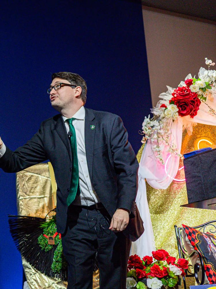 Josh Weidner on stage during the closing of the comedy magic set at the GiGi's Playhouse Indy gala.