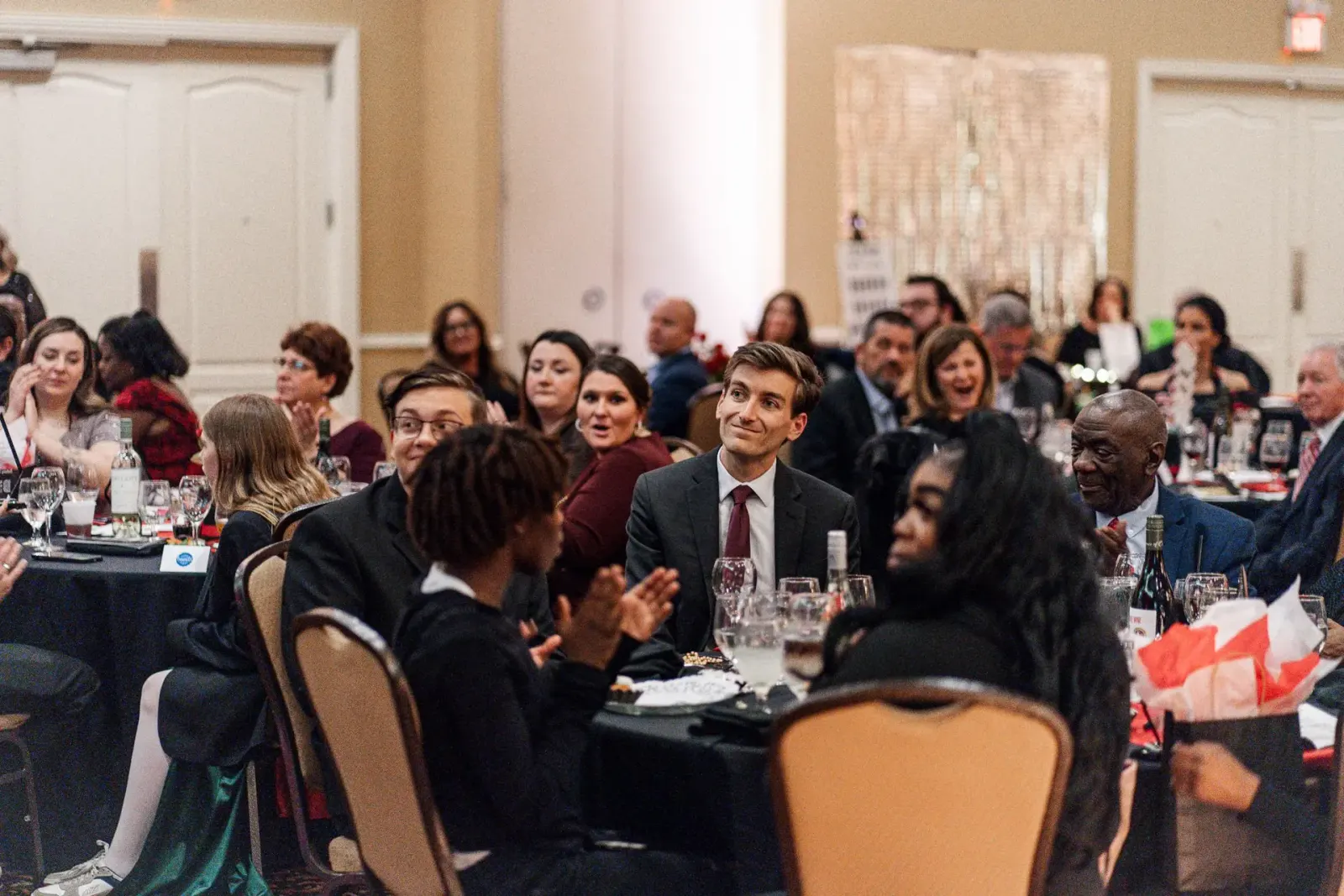 Kansas City magician Josh Weidner performing comedy magic for guests at a corporate event